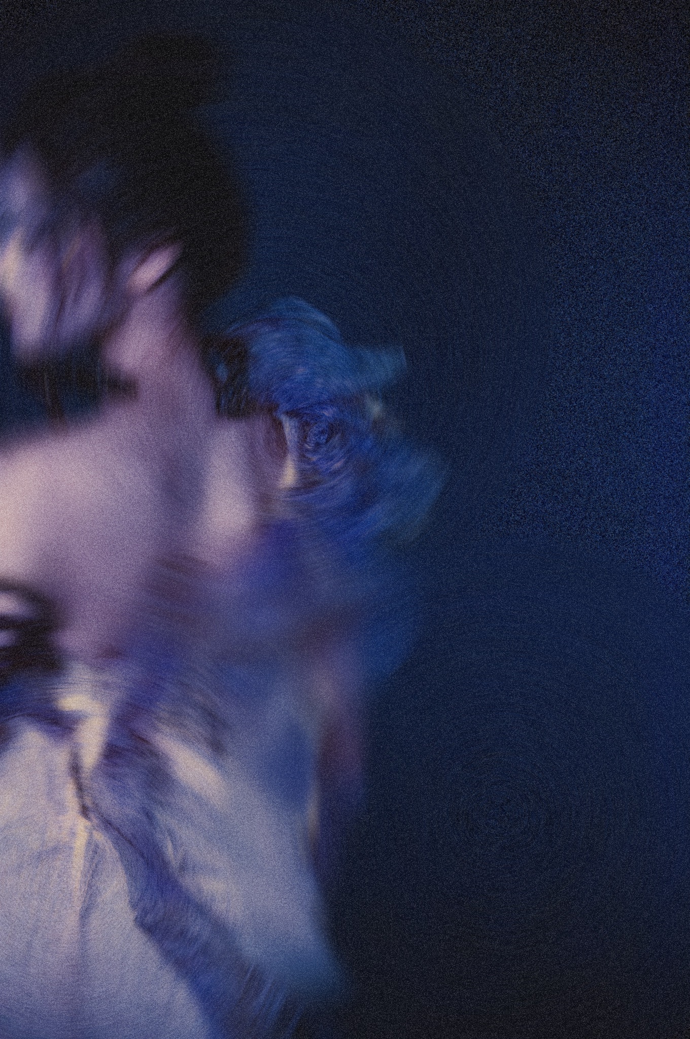 Balance, a long-exposure portrait smeared into blue and violet against black
