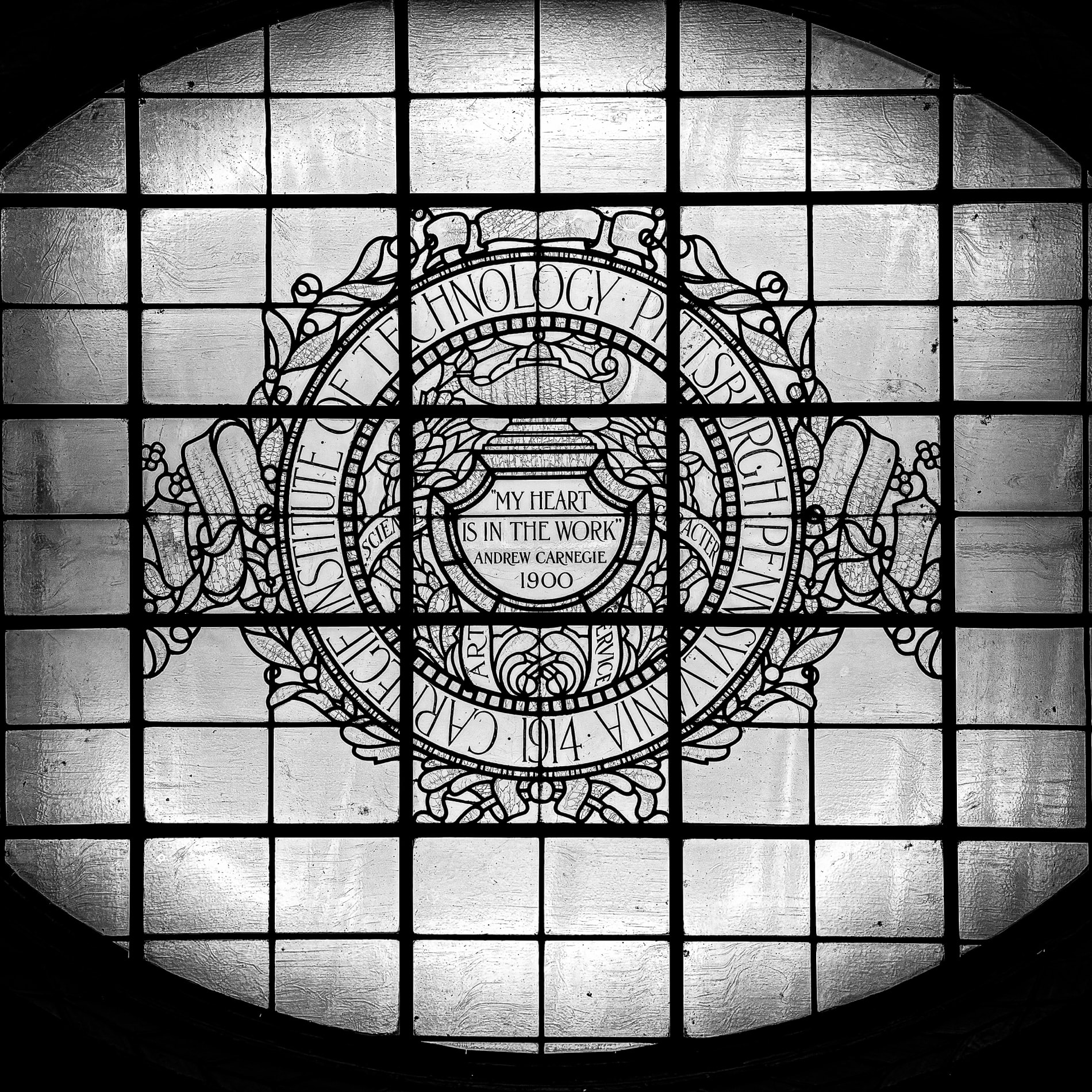 The Carnegie Institute of Technology seal in stained glass, reading my heart is in the work