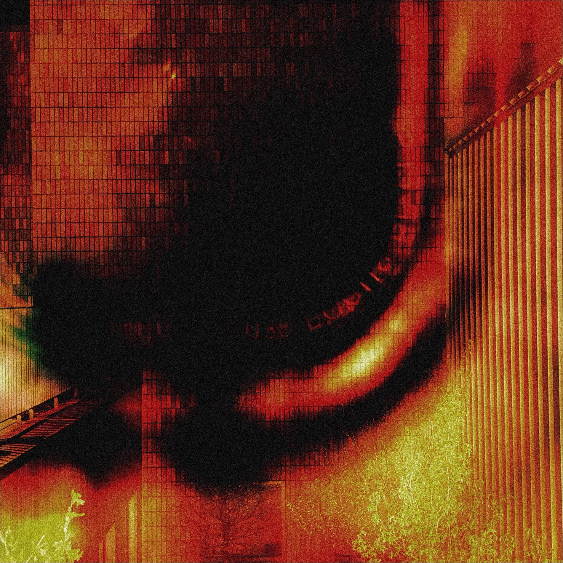 A building facade pulled into red and yellow scanner streaks by a black smear