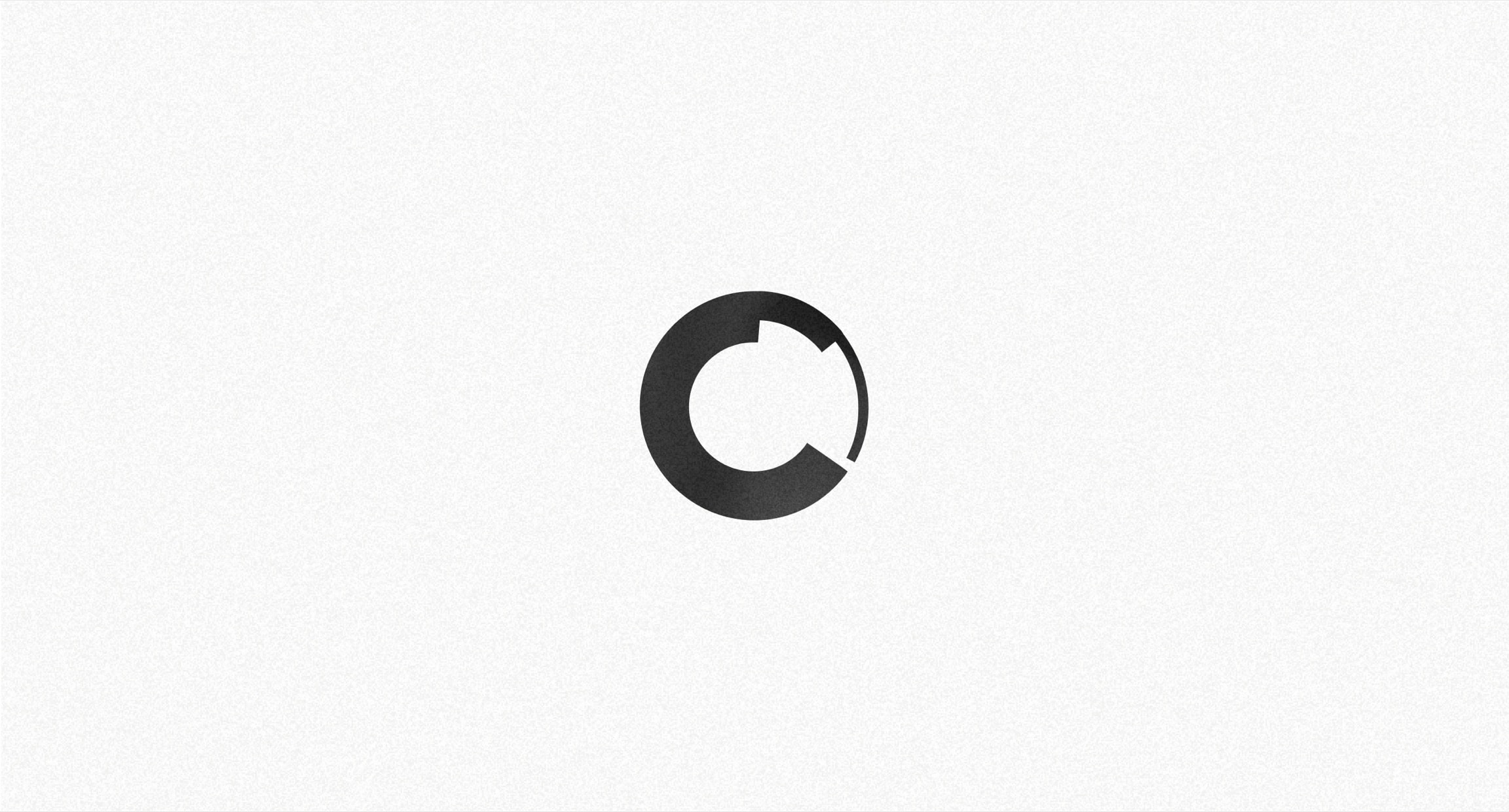 Kensho circular mark on a white textured field